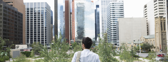 Man looking at a big city