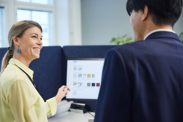 man and a woman looking at computer screen