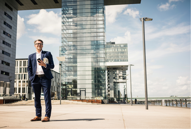 Man standing in front of buildings