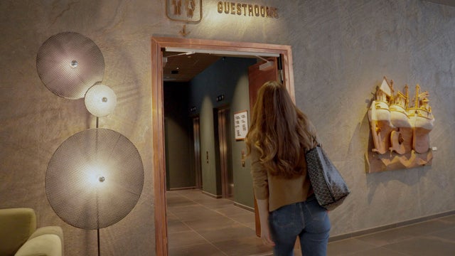 woman walking in Clarion Hotel Draken