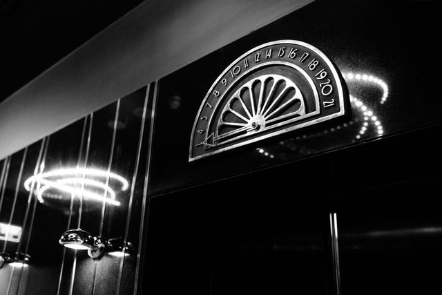 Black and white picture of an old elevator.