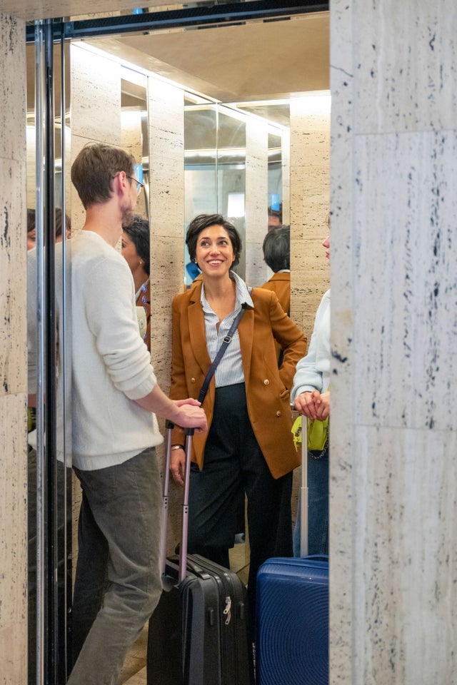 man and woman inside elevator in hospital