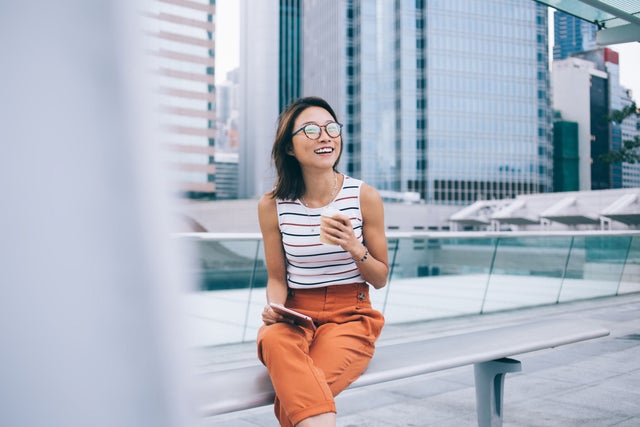 Woman sitting outside with coffee