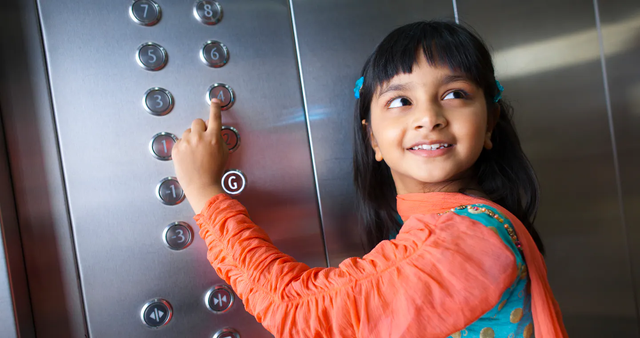 Child pressing elevator button