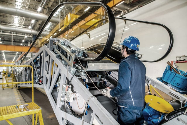 KONe technician working on escalator replacement