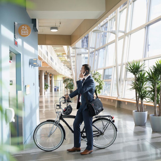 oerson going into an elevator with bicycle