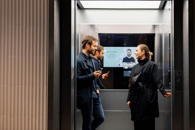 Two people in an elevator