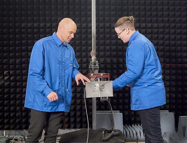 Two men with technical equipment