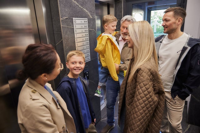 A family in an elevator 