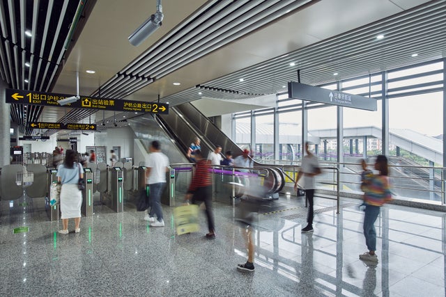 Escalator at an airport with moving people