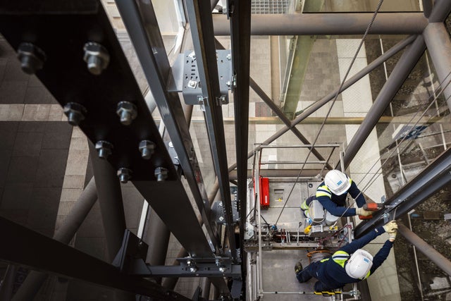 Elevator shaft with workers