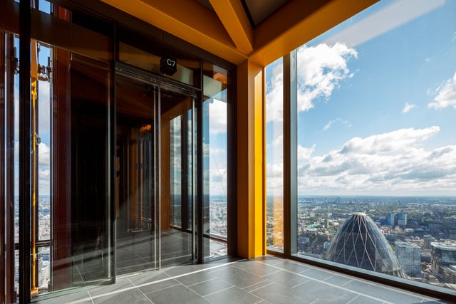 high-rise building view from up with elevator
