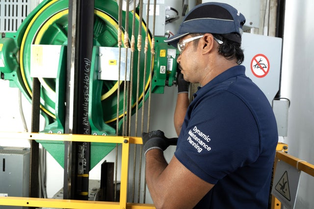 KONE technician with elevator equipment
