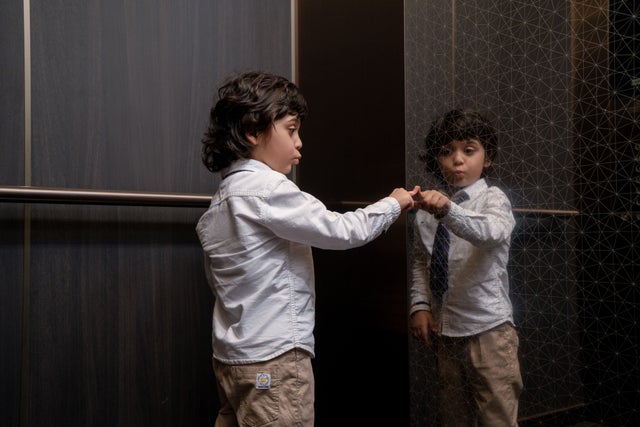 Boy touching elevator