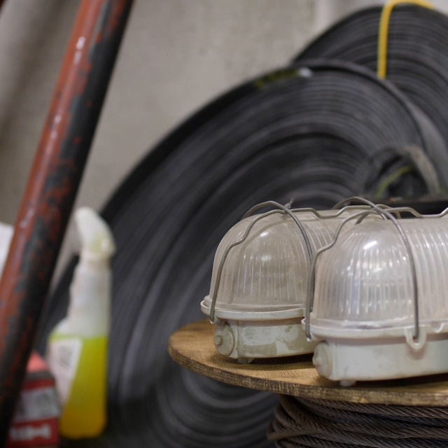 Two lights in a table and construction components in the background.