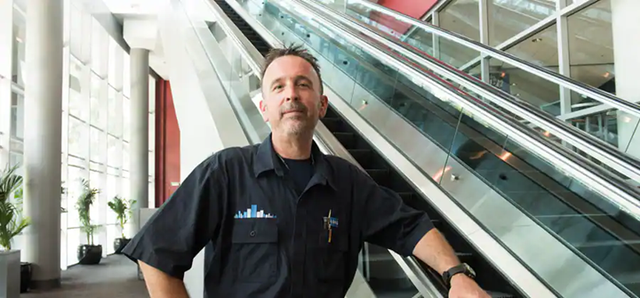  KONE’s Dennis Vitt, primary service mechanic in front of the escalatros at the Staples Center