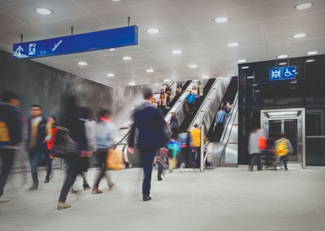 Transport station with moving people