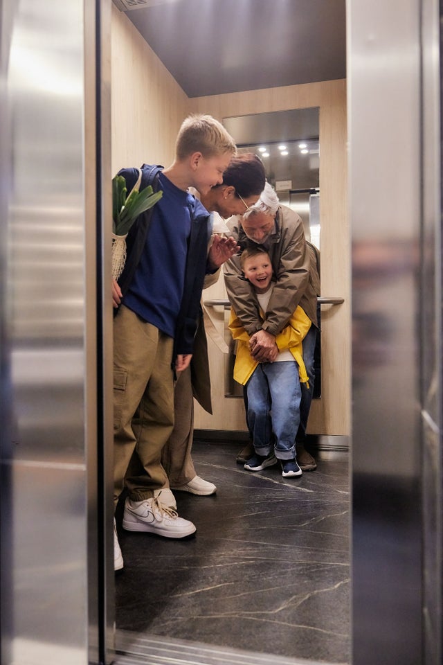 family inside elevator