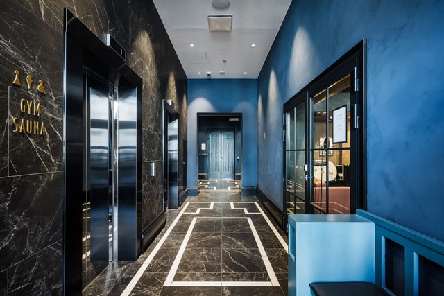 Scandic grand central elevator lobby with blue walls.