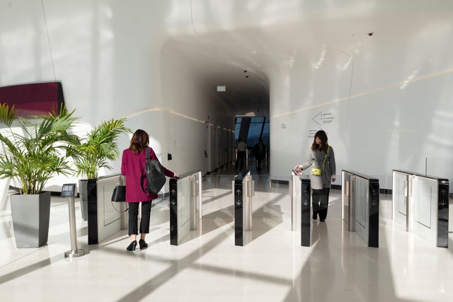 Woman walking through an access gate