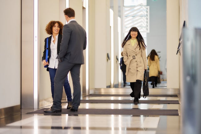 elevator lobby with people walking