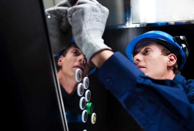KONE Technician inside elevator working