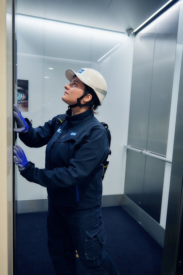 KONE technician repairing an elevator