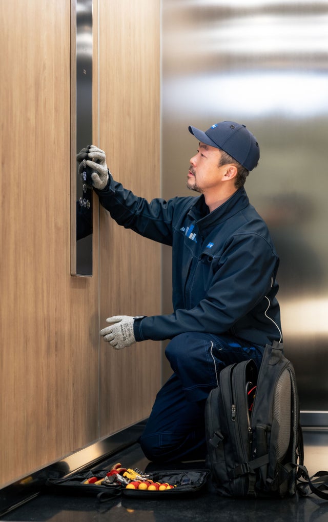 KONE technicial repairing elevator