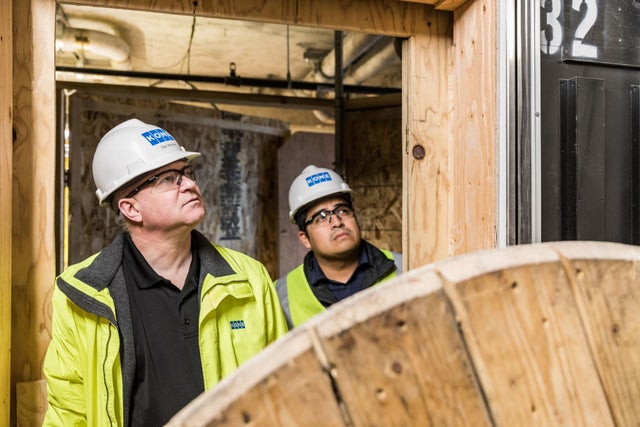 Two KONE workers on construction site