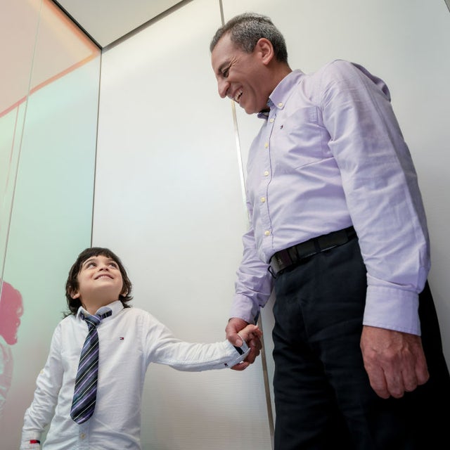 Grandfather and child in elevator