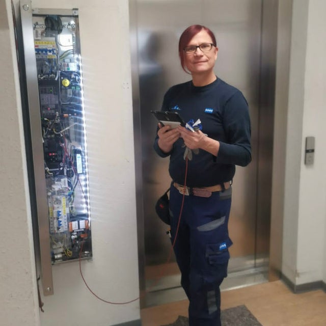 Celine fixing an elevator from the outside.