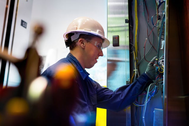 KONE technician working on an elevator.