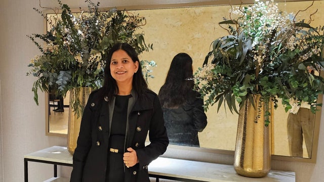 Woman posing in front of a mirror