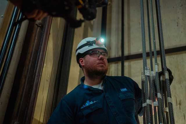 John Walsh jr. fixing an elevator