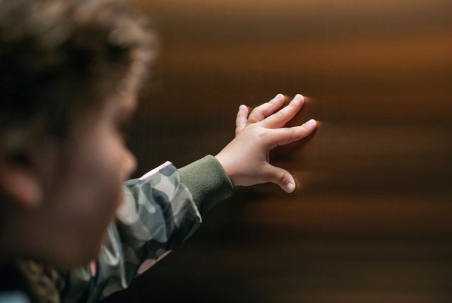 Kid touching an elevator