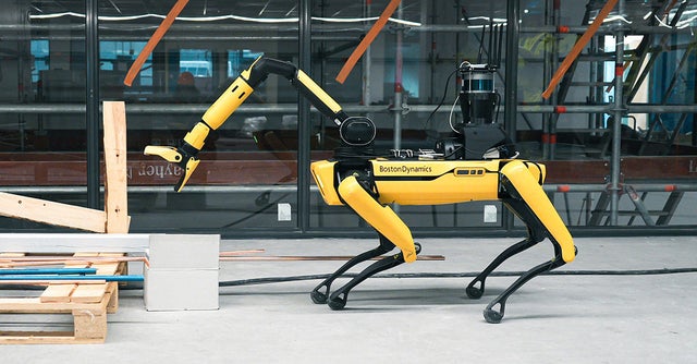 Yellow and black colored BostonDynamics robot