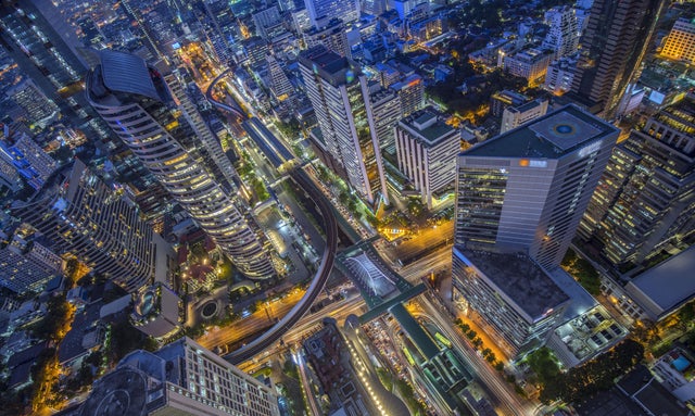 Birds eye view of modern buildings at night. Traffic in the business district near Skytrain station Chong Nonsi, Bangkok, Thailand., urbanization, bird-eye, aerial, buildings, city, night, high-rise, business district, sky-scraper, traffic, light