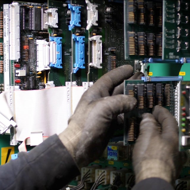 Technician fixing a electricity cabinet.