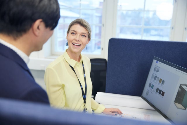 two people looking at laptop