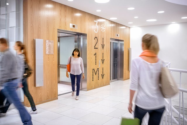 shopping center elevators and people