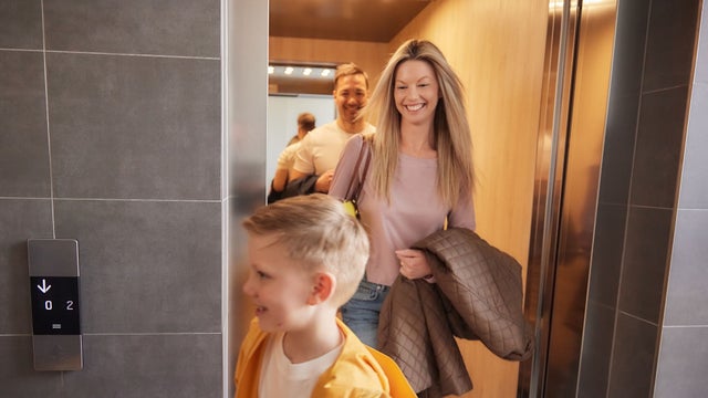 women and kid leaving the elevator