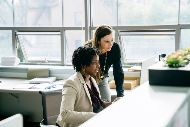 Two people working together in an office