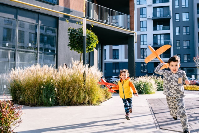 Children playing uotside a residential building