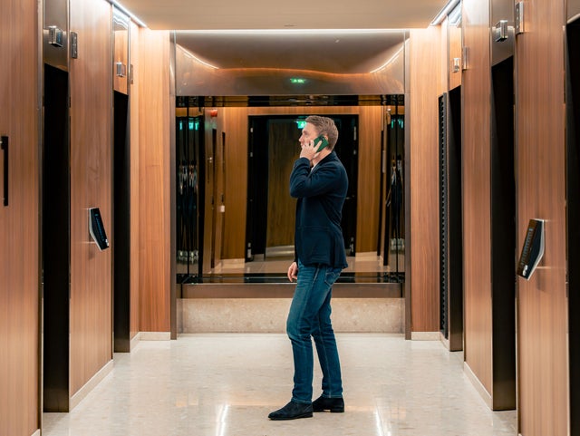 man waiting for elevator in Karlatornet