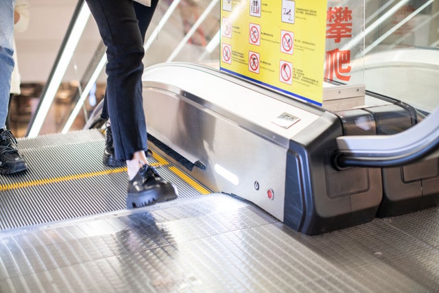 Person on escalator