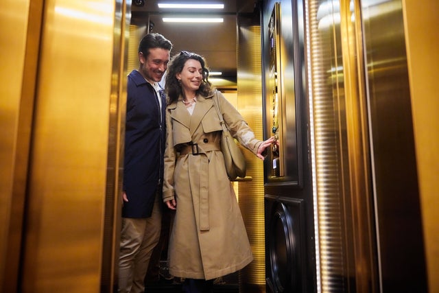 Man and a woman inside an elevator