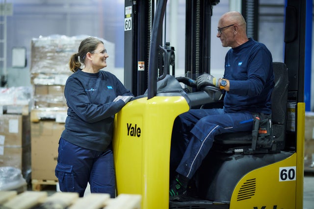 Fork lift , woman and man