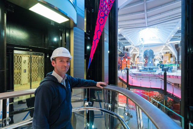 Harmony of the Seas interior with KONE technician