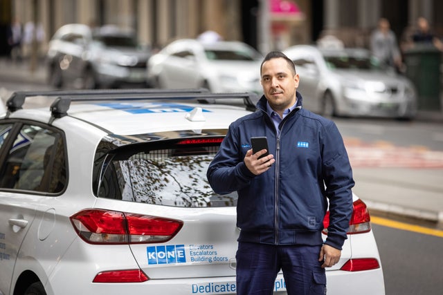KONE technician by his car