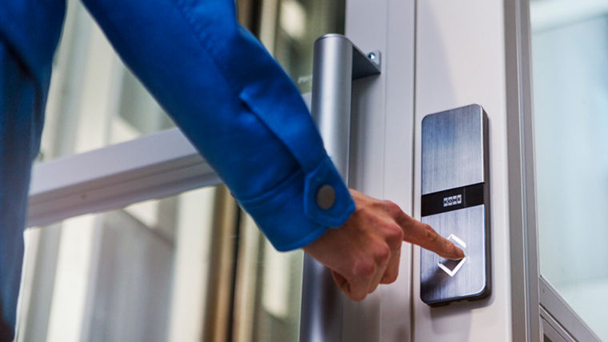 A person pushing an elevator button